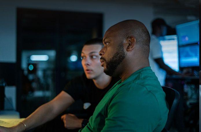 A GAPAT mentor and trader reviewing charts together